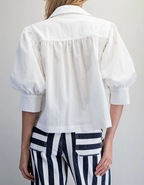 Off-white puff-sleeve button-down top, additional view showing sleeve and button detail