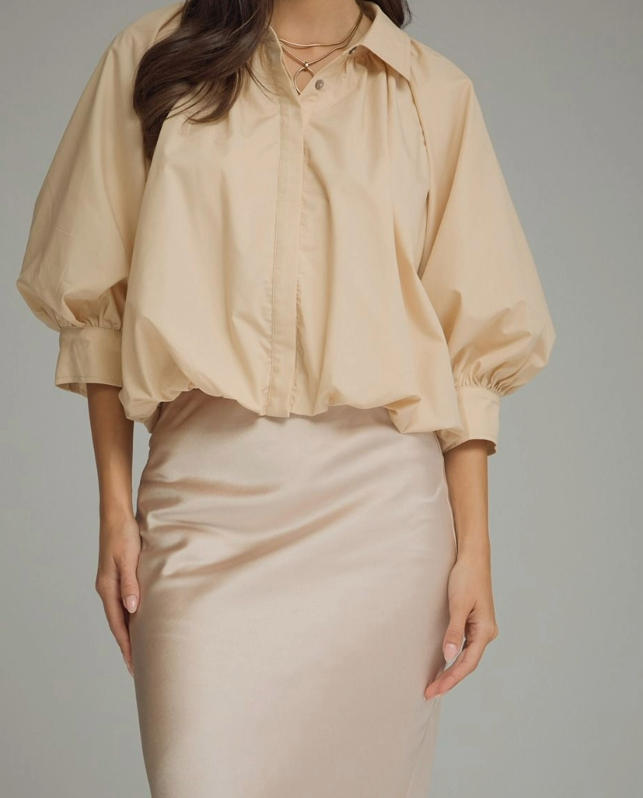 Ecru puff sleeve top with three-quarter puff sleeve and button cuff