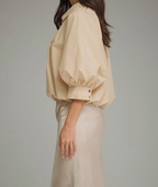 Ecru puff sleeve top with gathered front yoke and button placket